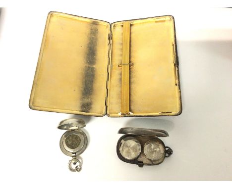 Two silver coin cases and a silver cigarette case.