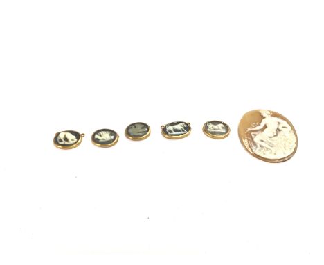 A group of small vintage gold mounted cameos and one other. Postage A
