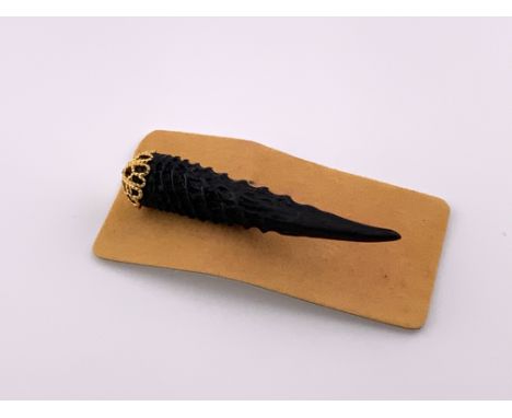 A Vintage Dik Dik horn brooch with original Export certificate.
