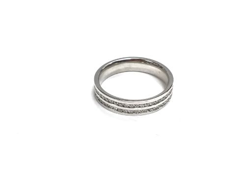 An 18ct white gold diamond wedding ring. Approximately Size R 1/2 5.3g and 0.84ct.