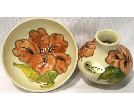 Moorcroft small cream ground bulbous vase in the Hibiscus pattern, H: 70 mm and a similar footed bowl. P&amp;P Group 2 (£18+V
