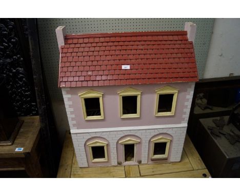 A Vintage painted wooden dolls house.