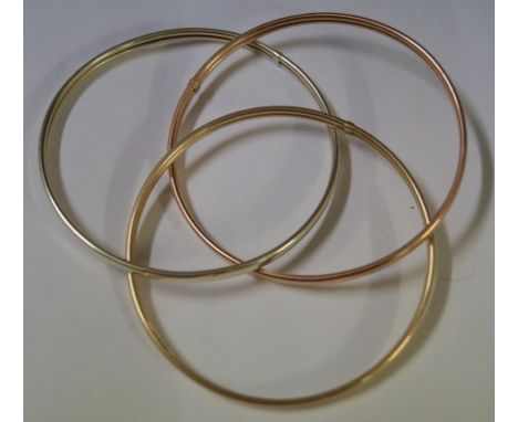 A tri-coloured Russian bangle, in white, rose and yellow metal, unmarked, weight 13.5g
