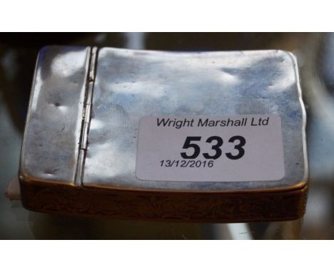 A continental white metal snuff box of rectangular form with chased and engraved floral decoration.