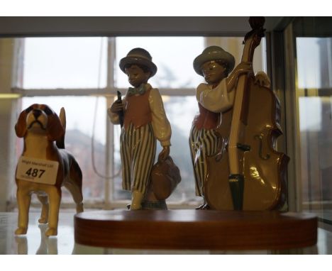 A group of ceramic items to include a Beswick model of Champion Beagle Wendover Billy, a Lladro model of a cello player and a