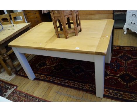 A good quality light oak finished shabby chic extending dining table.