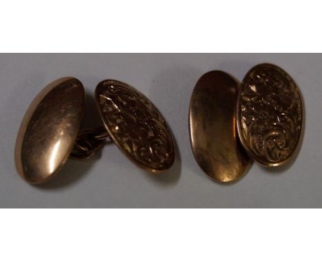 A pair of gold cufflinks, with engraved detail, weight combined 4.9g