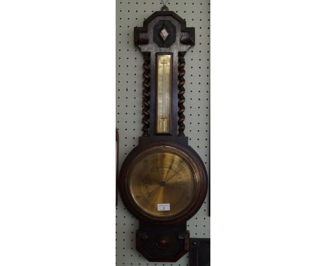 A 1920's oak cased banjo barometer with barley twist columns and brass dial 