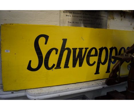 A Vintage Schweppes advertising tin sign.