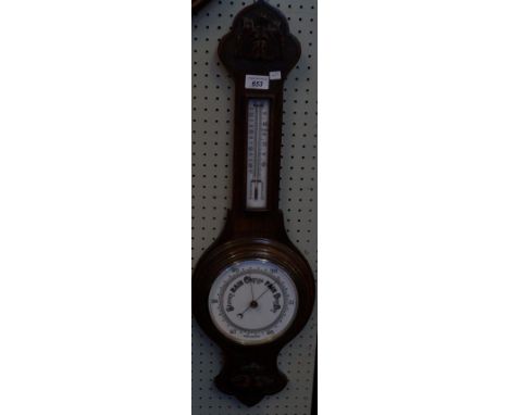 A 20th Century oak barometer.