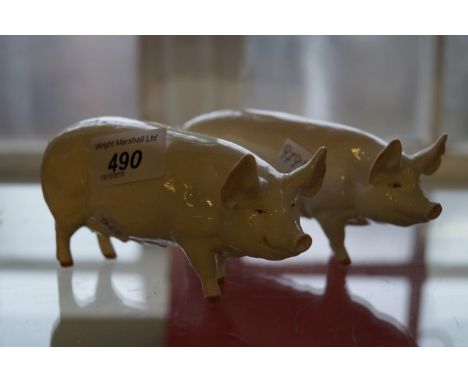 A group of ceramic items to include two Beswick models of pigs, The War Queen (2)