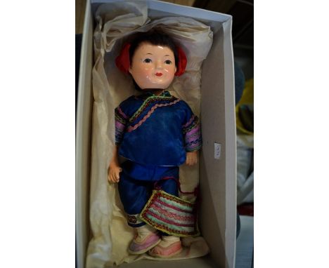 A vintage lacquered doll 