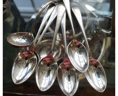 A set of six Sheffield hallmarked silver tablespoons together with a further Sheffield hallmarked silver ladle (7).