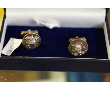 A pair of American sterling silver cuff-links each with embossed American eagle motto, complete with certificate which states