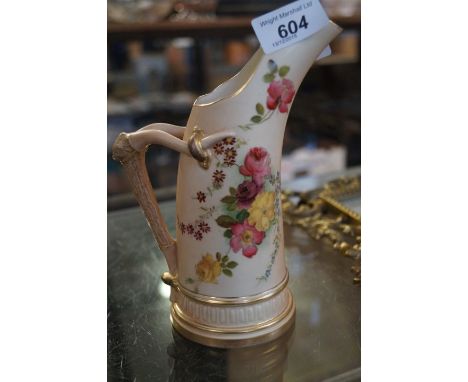 A Royal Worcester blush ivory ewer with hand painted floral decoration and gilt rim and base with horn style handle CONDITION