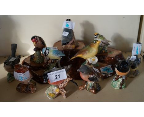 Eleven assorted Beswick birds, comprising Blue Tit, Nuthatch, Greenfinch, Bullfinch, also a Beswick ceramic stand