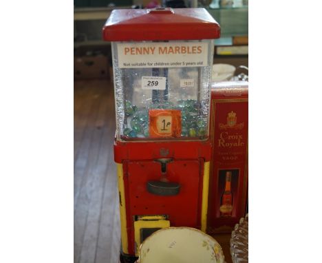 A vintage painted penny slot machine 