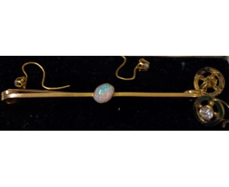 An opal bar brooch, centrally set to a yellow metal bar marked 15ct, together with a pair of seed pearl and yellow metal ear 