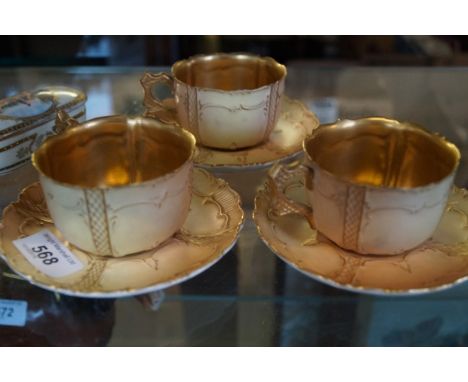 Three Royal Worcester gilt decorated blush ivory cups and saucers.