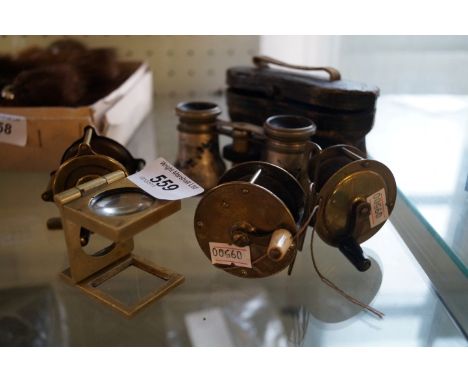 A mixed group of vintage brass fishing reels and cased set of hand painted opera glasses.