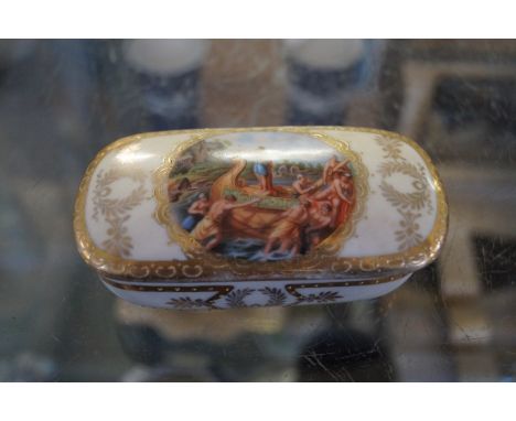 A Vienna porcelain lidded trinket box with central roundel depicting a man on a boat in river landscape with all over gilt fl