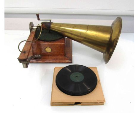 An oak cased Gramophone and Typewriter Ltd gramophone with spin brass horn and leather elbow circa 1904, with Berliner record