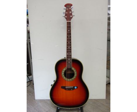 A Tanglewood electro-acoustic guitar with plastic back