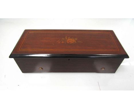 A lever-wind comb and cylinder music box, maker unknown, the rosewood case with inlaid lid. Cylinder 28cm long. Rosewood case