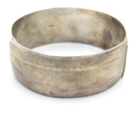 A 1941 Charles Horner, Chester silver bangle with machined decor, 58mm diameter at widest, 41g