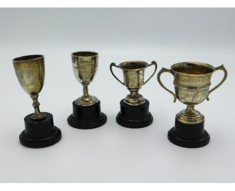 Four small Birmingham silver sporting trophies awarded in 1930's for tennis to E. H. Bale & D. Wilkinson, silver weight, 77.7