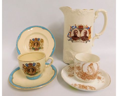 A Clarice Cliff QEII trio twinned with a Lord Kitchener & General French commemorative jug & Queen Victoria cup & saucer