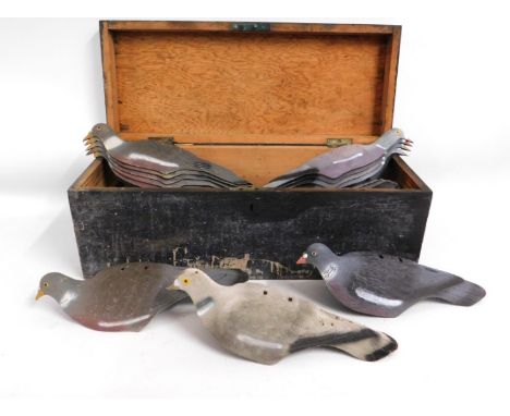 A truck with contents of 24 pigeon decoys, trunk measures 28.5in wide x 11.5in deep x 10.5in high