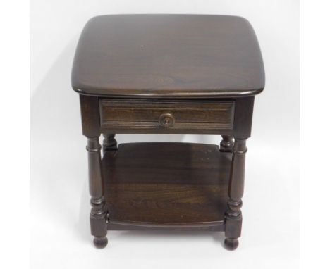 An Ercol elm lamp table with drawer & shelf under, 18.75in wide x 17.75in deep x 21.5in high