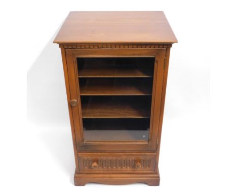 An Ercol 'Golden Dawn' elm hifi separates cabinet with adjustable shelves & drawer, 38in high x 21.875in wide x 19.25in deep