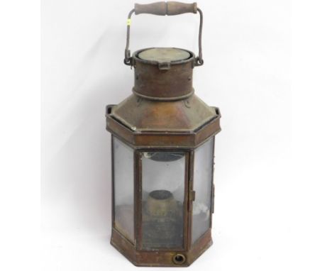 A copper lantern with brass wall hook to rear, 20in high