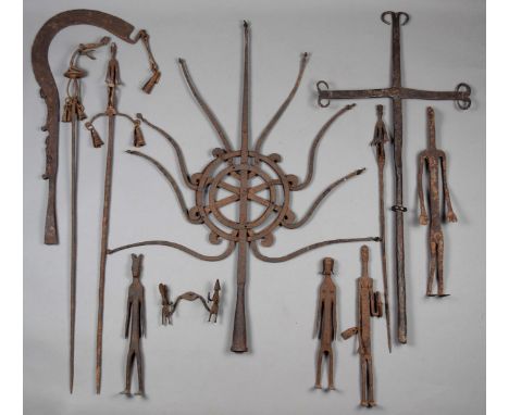 Four Dogon standing figures Mali iron, and a currency blade, three staffs, two smaller figures, a cross and an Oriental staff