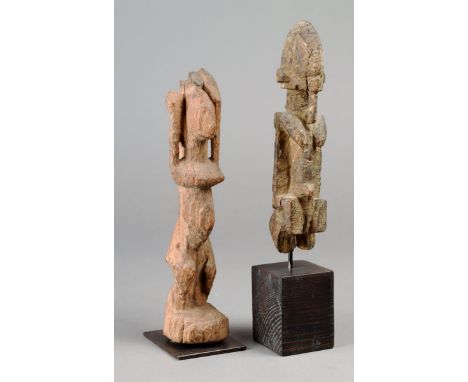 Two Dogon fragmentary figures Mali wood, including one with stretched arms, the other with a lip plug, 20cm and 17cm high, on