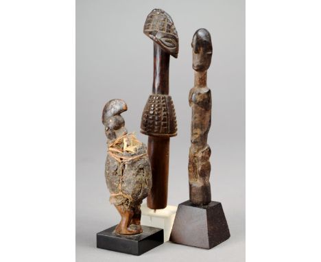 A Byanzi figural gourd stopper Democratic Republic of Congo wood, with a crested and diced coiffure and skirt, 13.5cm high, o