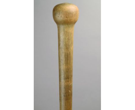 λ A Zulu rhinoceros horn knobkerrie South Africa in two parts with a spherical finial and a tapering shaft, with a hide space