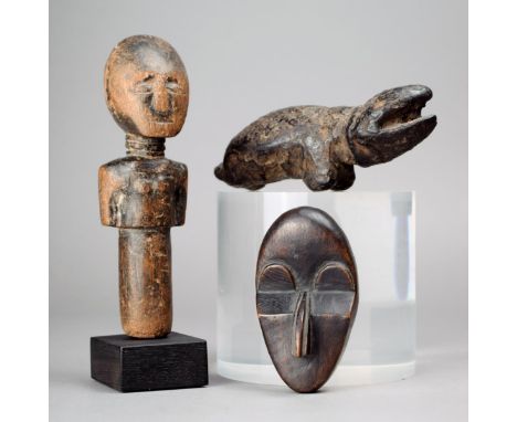 An Akan doll Ghana wood, the carved torso and head with a triple ringed neck, 14.5cm high, on a stand, a Bambara chameleon wi