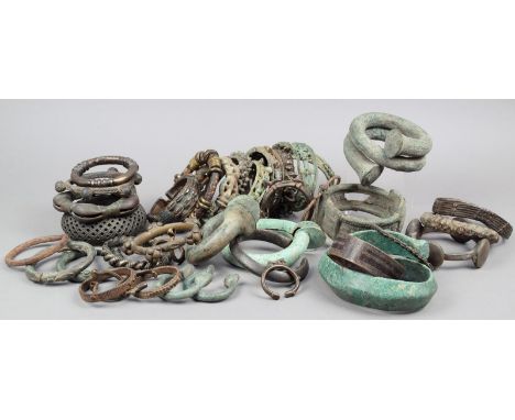 Thirty nine African bangles bronze, brass, copper, stone, including examples cast with masks and animals, another with cowrie