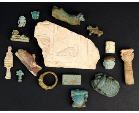 A group of Egyptian antiquities Late Period and later mainly faience including a large scarab, a Pataikos torso, a scarab rin