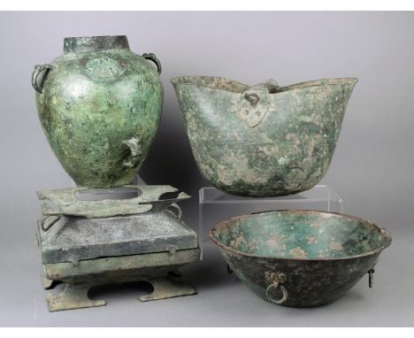 Four Archaistic style bronze vessels including an ovoid jar with three handles, a bowl with four ring handles, a container wi