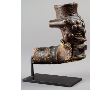 A Kuba anthropomorphic pipe bowl Democratic Republic of Congo wood, leather and metal studs, 11cm high, on a stand. (2) Prove