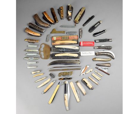 λ A collection of penknives including ten with ivory or bone scales, one unusual type with four blades; six with mother of pe