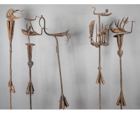 Nine Yoruba staffs Nigeria iron, with bird finials, conical bells, three with molten core spheres and another staff with a fi