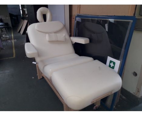 A leather effect adjustable bed/chair ideal for lumber problems