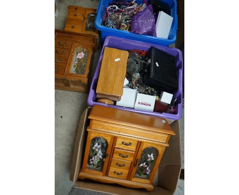 A large collection of mixed vintage and contemporary jewellery and jewellery boxes contained within three large boxes. 