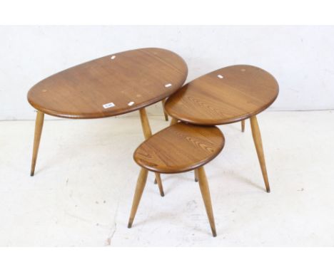 Ercol Light Elm and Beech ' Windsor No. 354 ' pattern Nest of Three Pebble Tables, largest 65cm long x 40cm high 