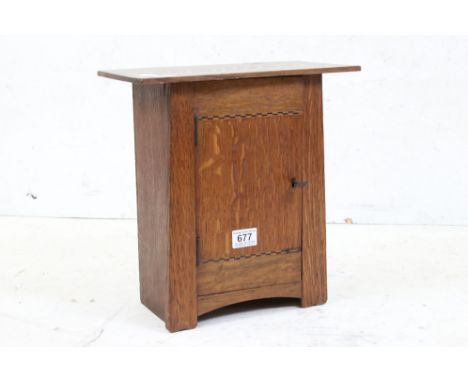 Arts and Crafts Inlaid Oak Table Top Cabinet in the manner of Liberty's, the single door with key opening to a shelf, 35cm hi